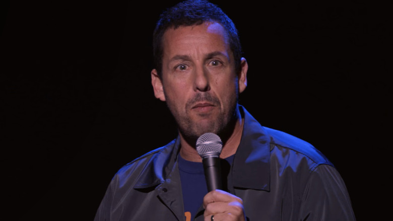 Adam Sandler performing on stage