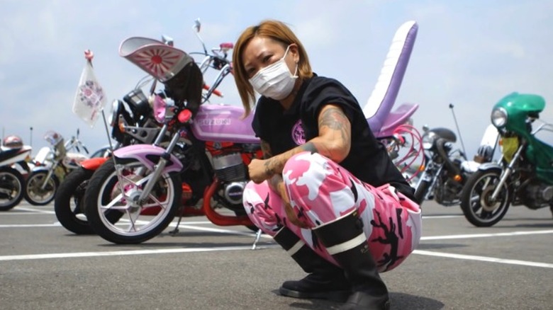 Modern bosozoku woman squatting