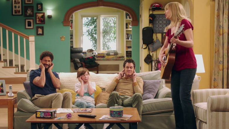 Judy Greer playing guitar to dissatisfied audience