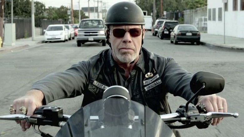 Clay riding his motorcycle looking menacing