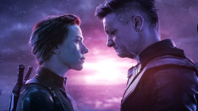 Black Widow and Hawkeye looking at each other