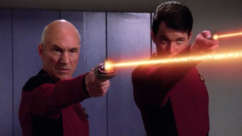 Picard and Riker firing phasers