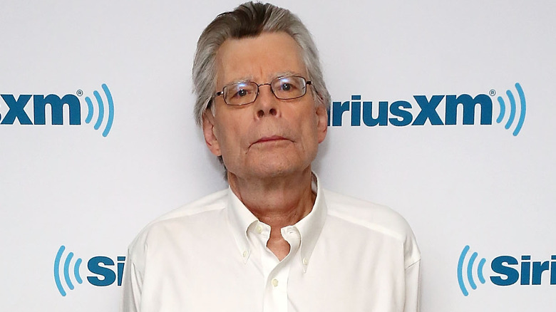 Stephen King posing for photo