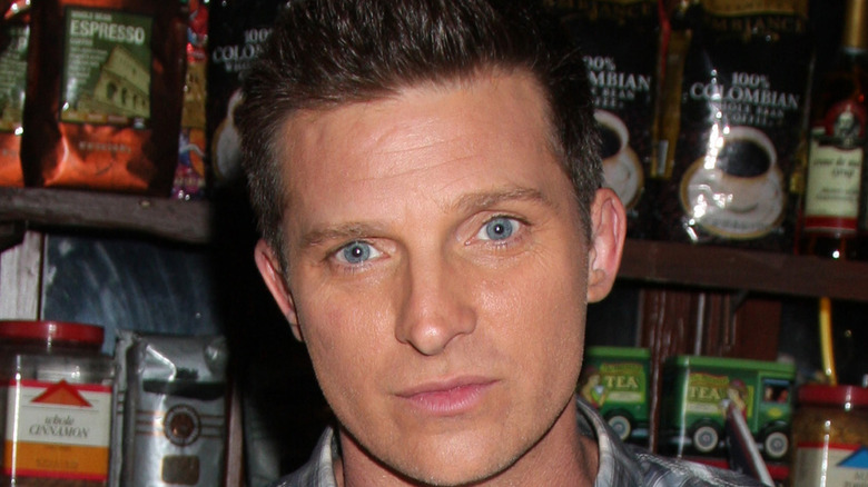 Steve Burton looking at camera with coffee behind him