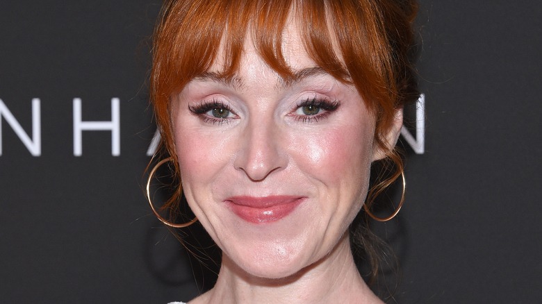 Ruth Connell smirking