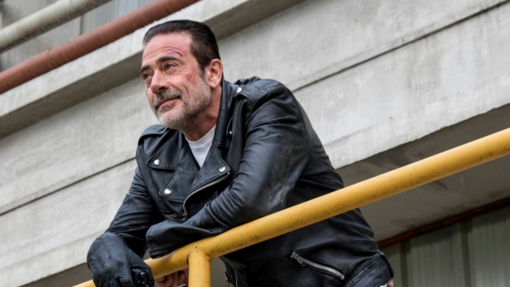 Negan leaning on a railing