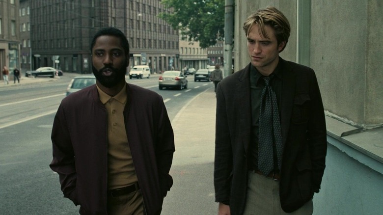 John David Washington and Robert Pattinson walking