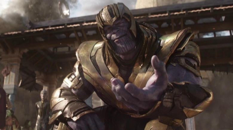 Thanos extends his hand to Gamora
