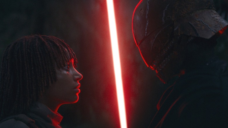 Qimir confronting Osha with lightsaber