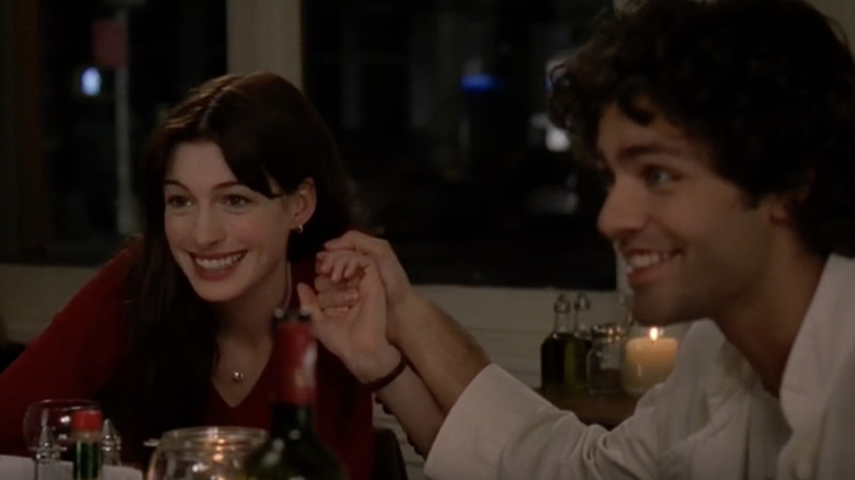 Anne Hathaway and Adrian Grenier holding hands