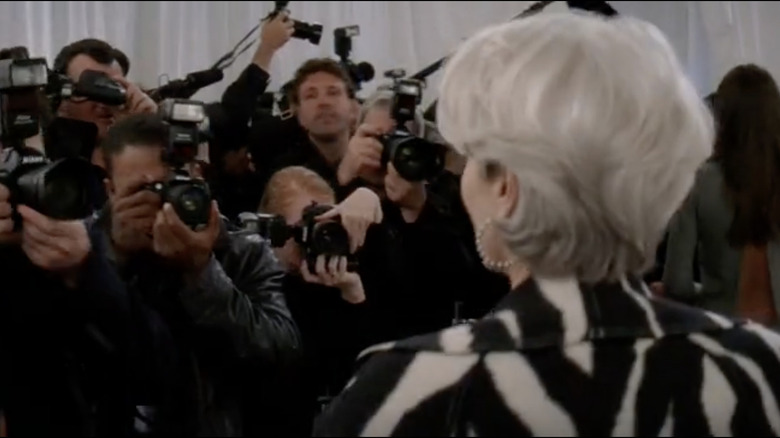 Meryl Streep posing in front of paparazzi as Miranda Priestly