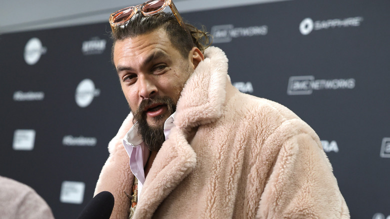 Jason Momoa wearing huge furry coat