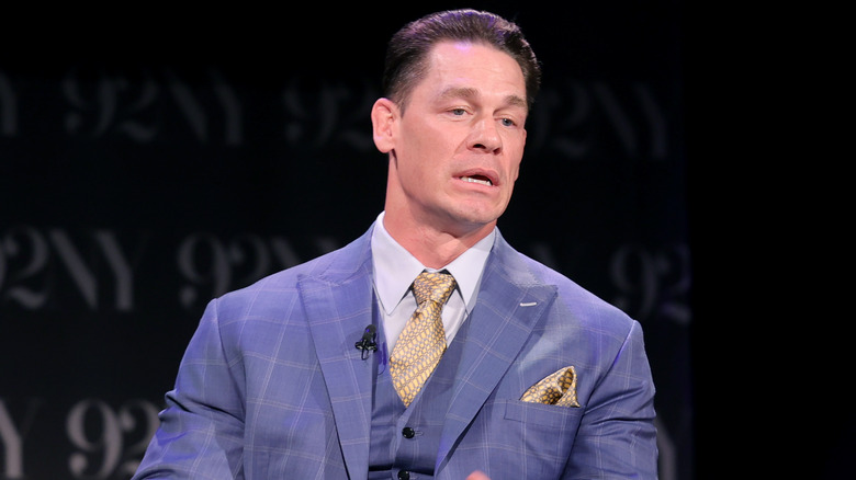 John Cena speaking in blue suit