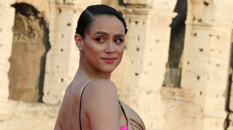 Nathalie Emmanuel looking over shoulder in Rome