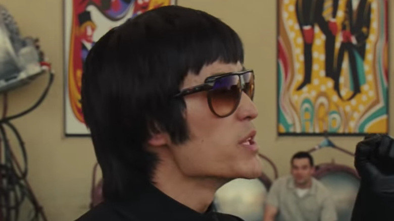 Bruce Lee wearing sunglasses