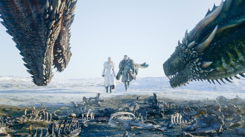 Daenerys Targaryen Jon Snow walking toward dragons 