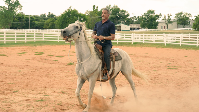 Sylvester Stallone riding a horse