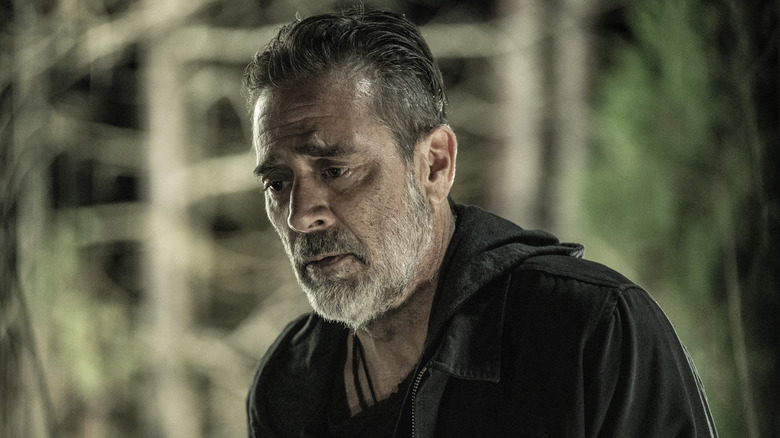 Negan looking down in defeat