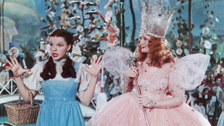 Dorothy emoting next to Glinda