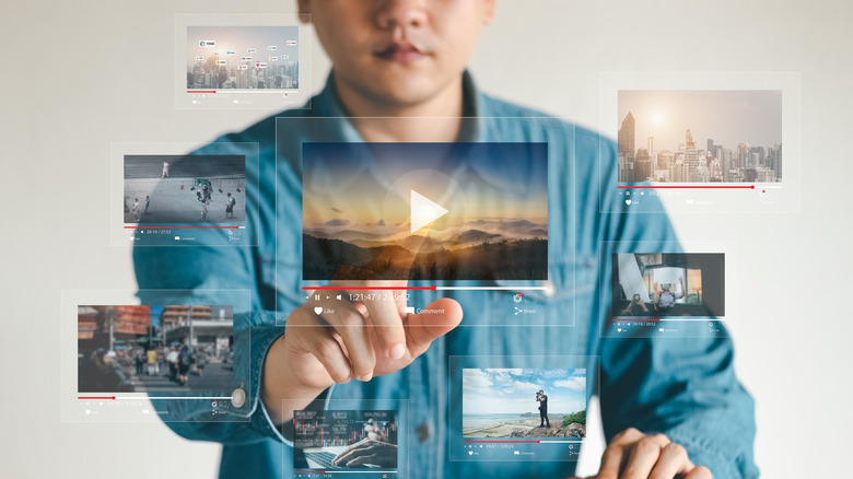 Man looking at video touch-screen