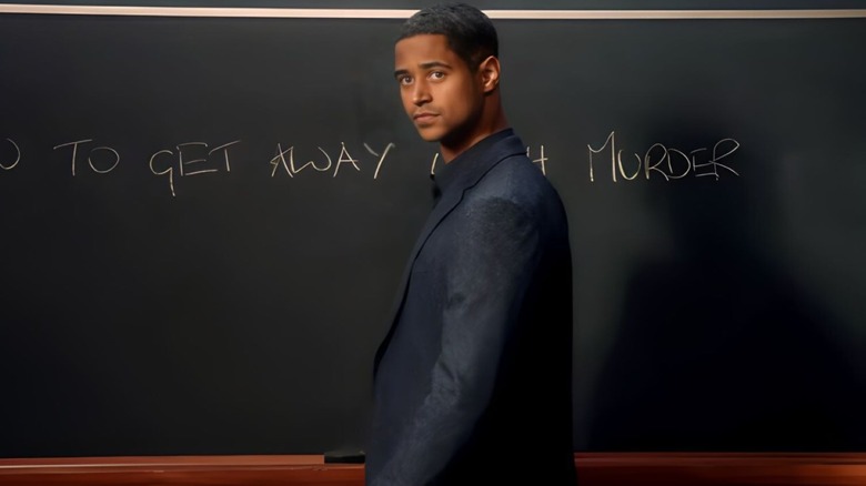 Christopher Castillo stands in a classroom