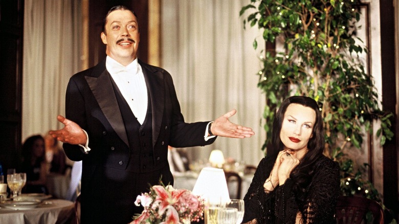 Gomez and Morticia at restaurant table (1998)