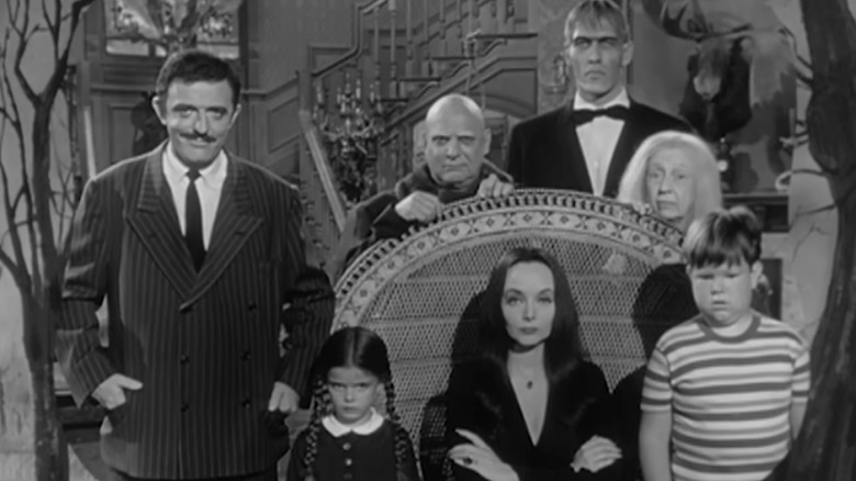 Addams family sitting in living room (1977)