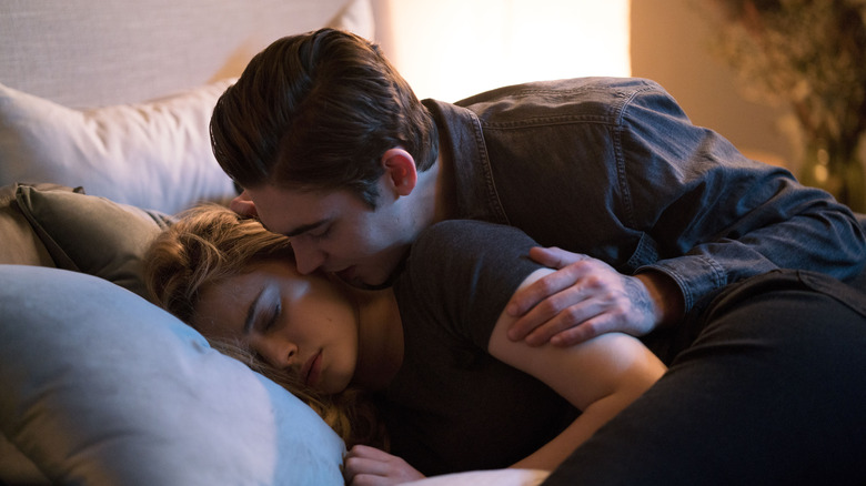 Hardin comforting Tessa as she lies in bed in "After Ever Happy."