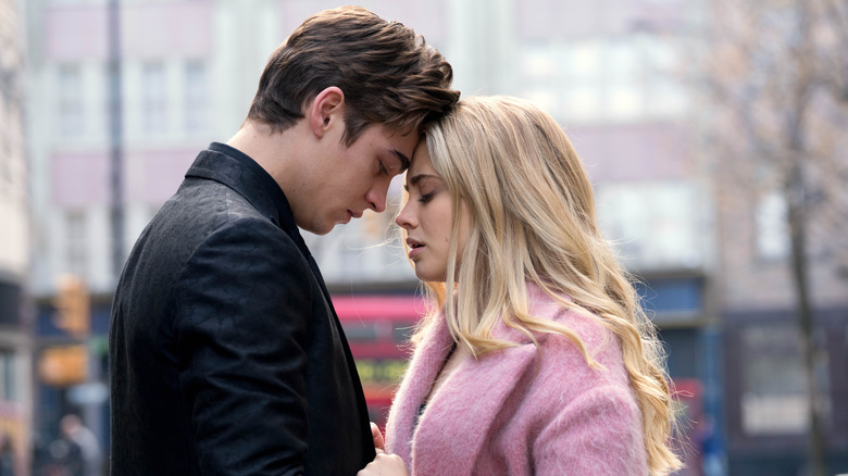 Hardin and Tessa standing in the street with their foreheads together in "After We Fell."