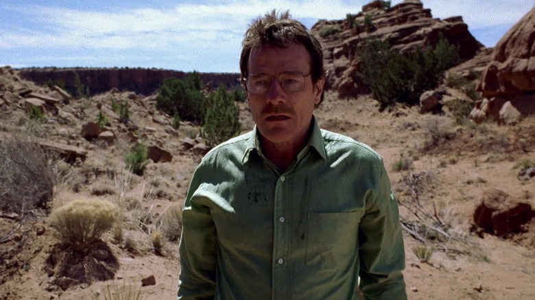 Walter White standing in the middle of the desert