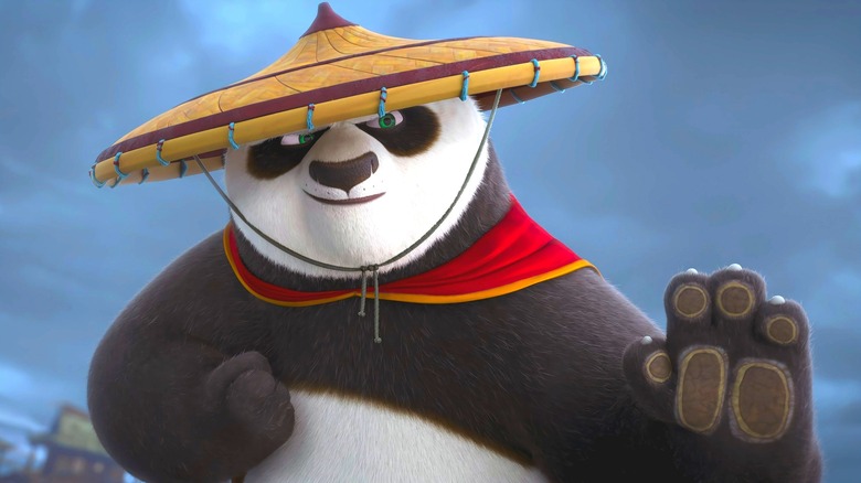 Po striking a kung fu pose while wearing a straw hat in Kung Fu Panda 3