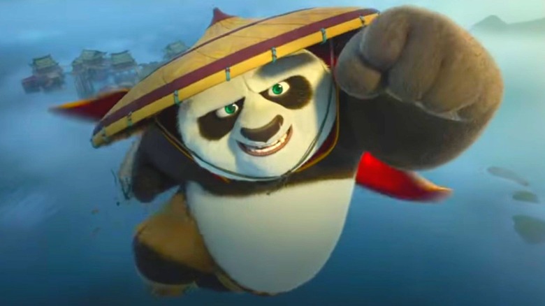 Po jumping with his fist raised in Kung Fu Panda 4