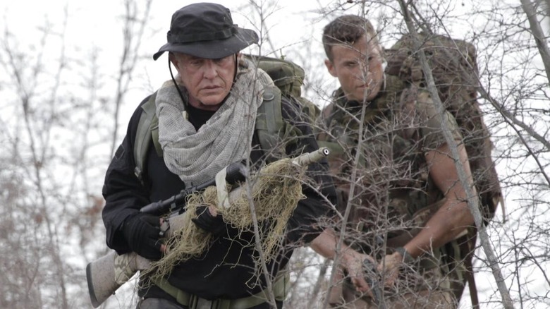 Thomas Beckett and Brandon Beckett walking in woods together