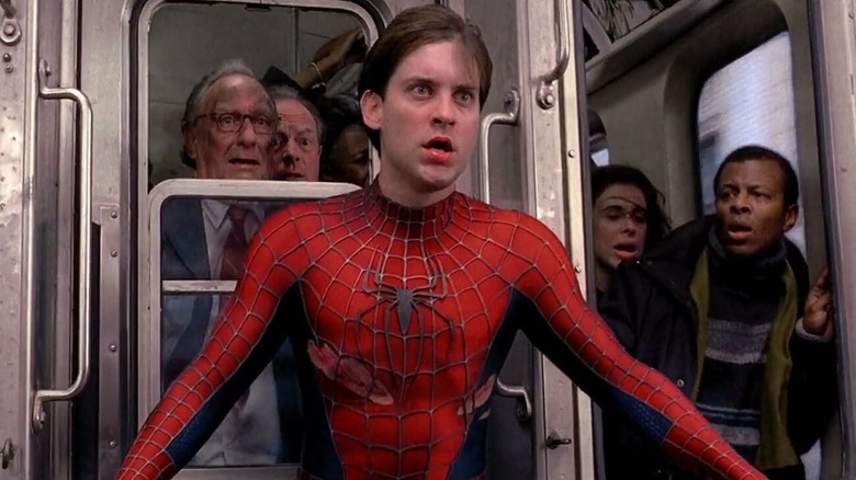 Maskless Spider-Man trying to stop train