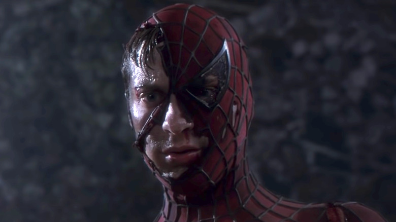 Spider-Man with torn and destroyed mask