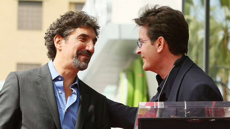 Chuck Lorre and Charlie Sheen embrace