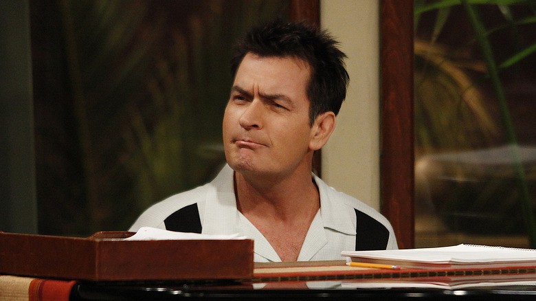 Charlie Harper frowning