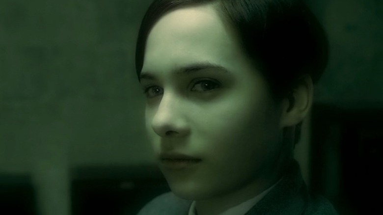 A teenage Tom Riddle looking forward