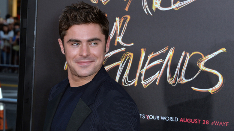 Zac Efron smiling at premiere