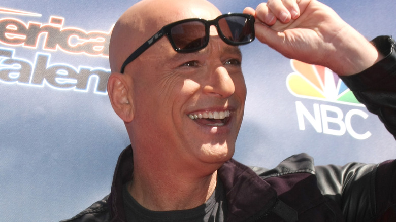 Howie Mandel Raising Sunglasses