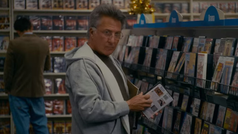 Dustin Hoffman holding DVD case