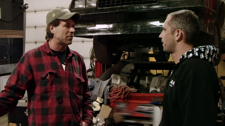 Two Ice Road Truckers fighting in a garage