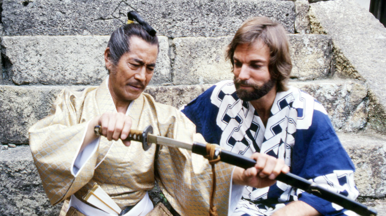 Toranaga and Blackthorne examine a katana