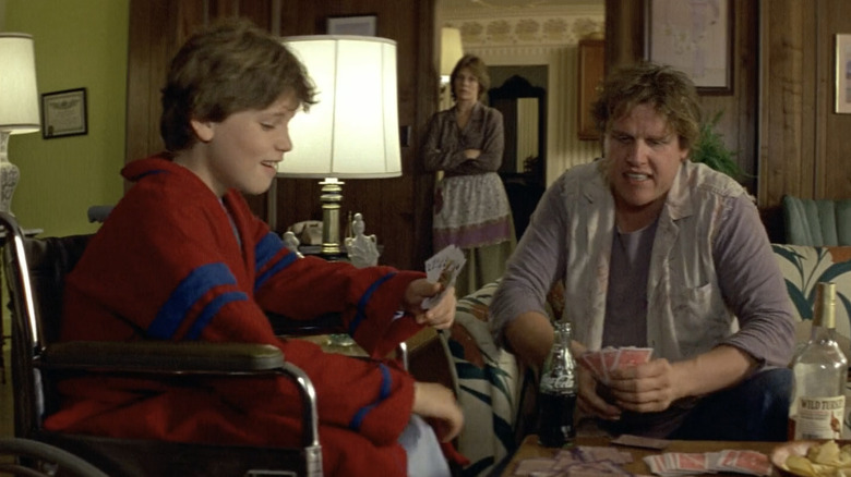 Gary Busey playing cards with Corey Haim