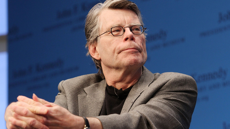 Stephen King sitting at JFK library