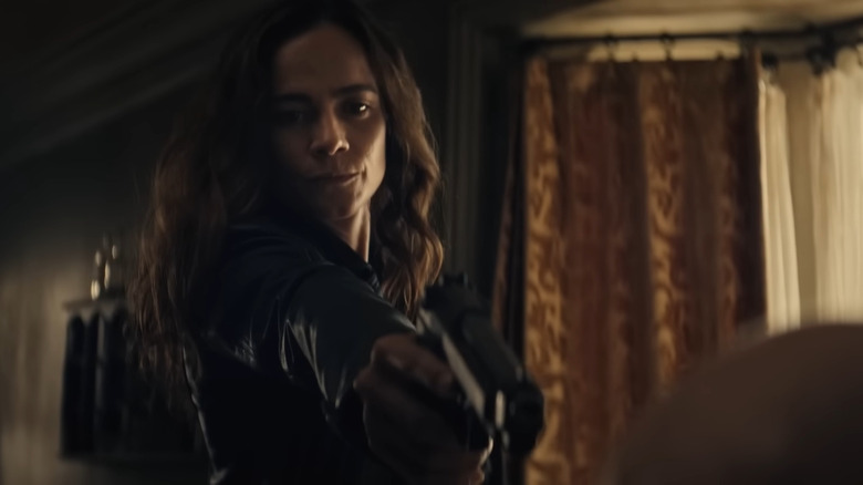 Alice Braga holds gun