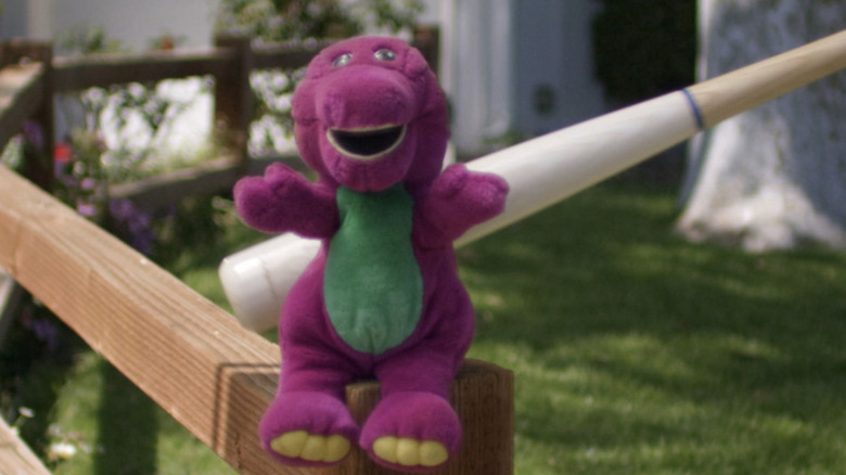 Baseball bat hitting plush Barney 