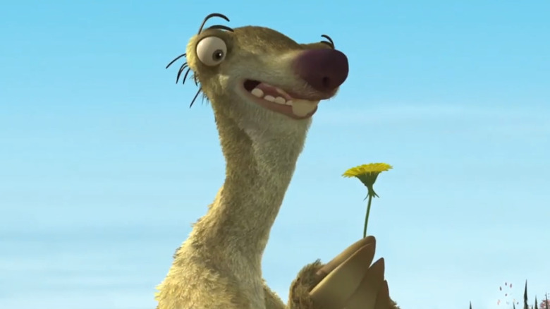 Sid holding a dandelion