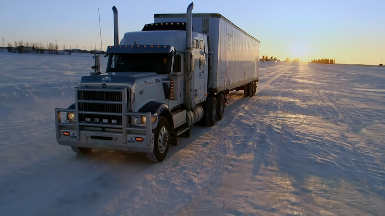 Alex Debogorski driving a truck through thin ice 