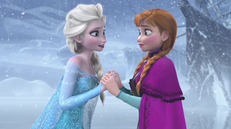 Anna and Elsa holding hands